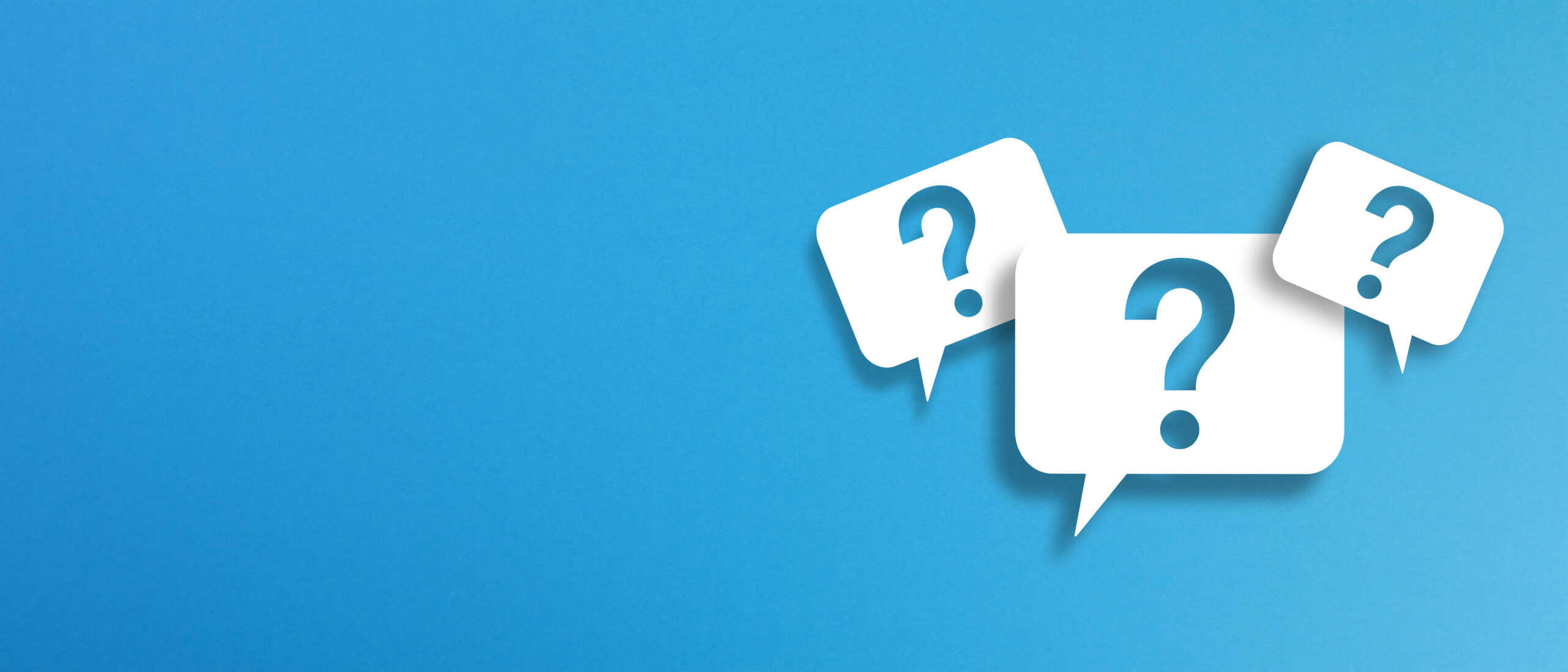 Question marks with speech bubbles on blue background